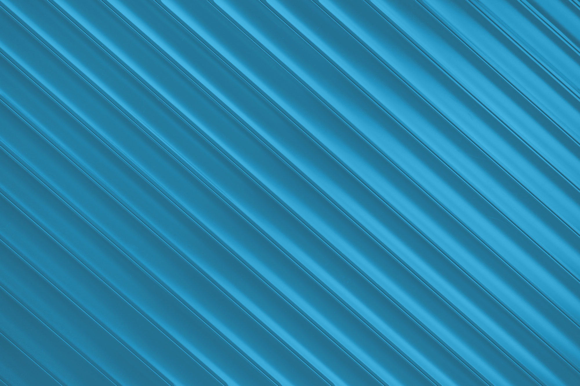 Surface texturée avec des bandes diagonales régulières en dégradé foncé bleu-gris.