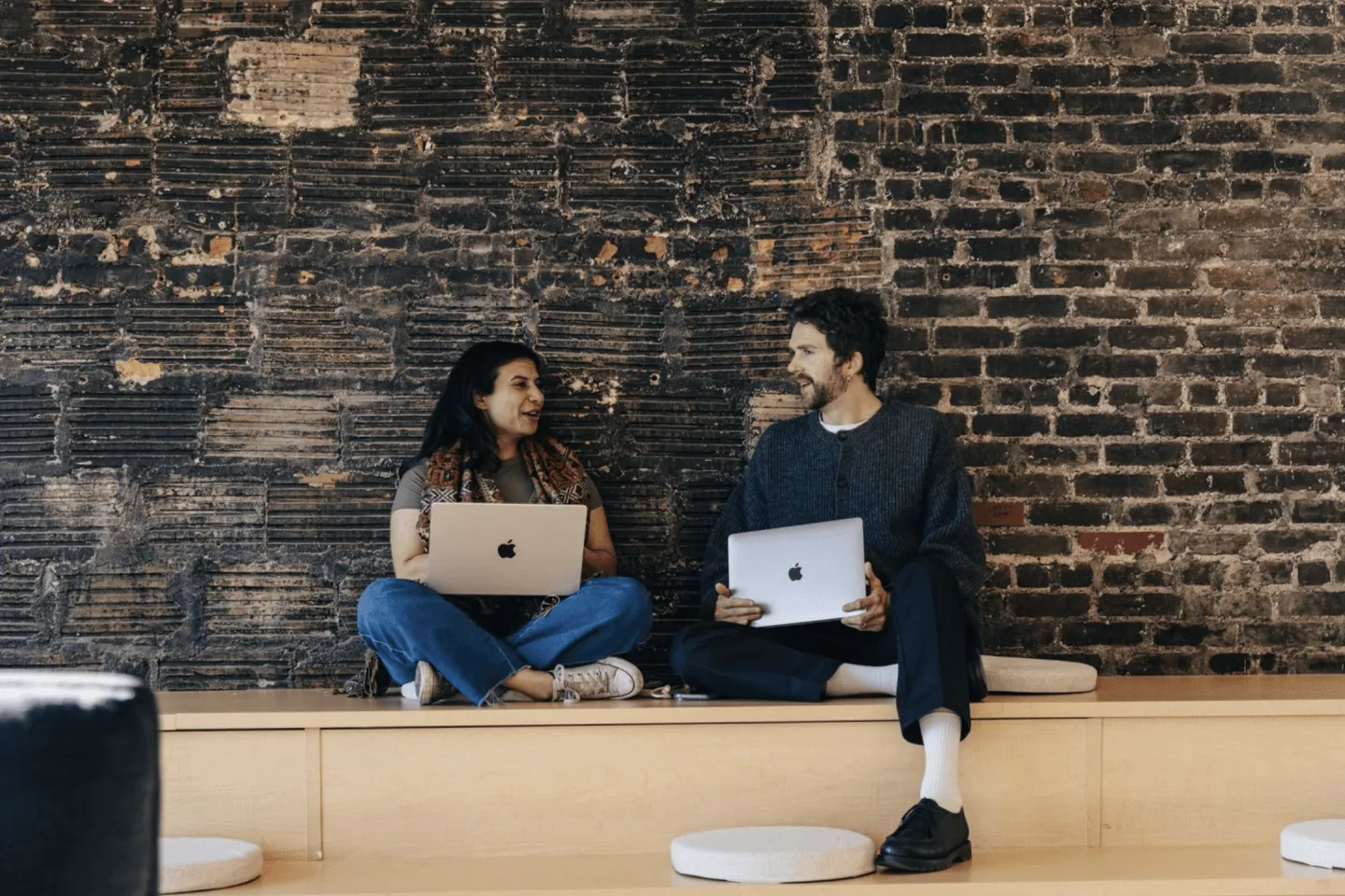 People in front of brick wall