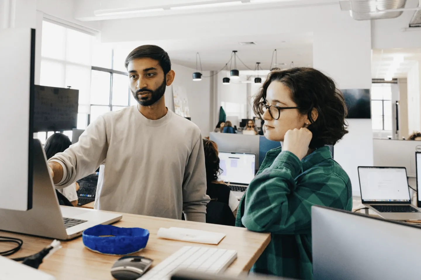 People working behind desk