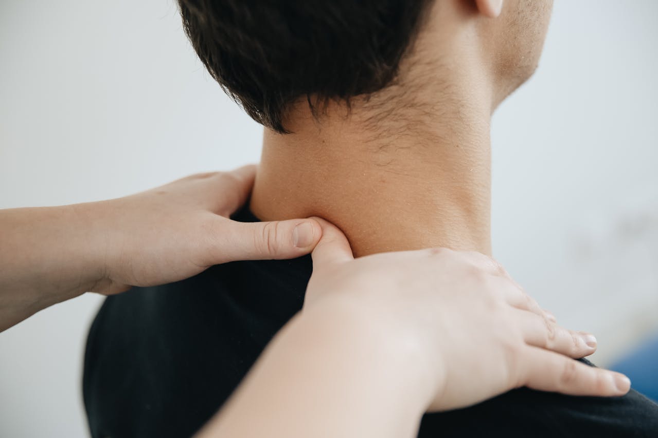 Photo by Funkcinės Terapijos Centras: https://www.pexels.com/photo/patients-neck-massaged-by-a-physiotherapist-20860604/