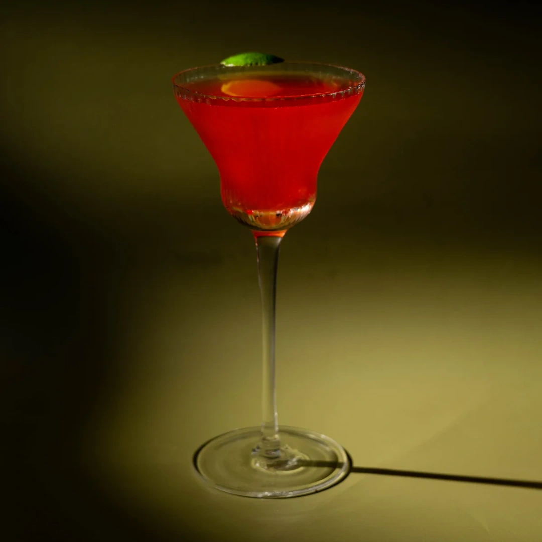 Non-alcoholic Caipritaly cocktail on an olive background