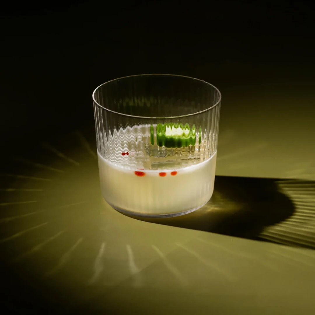 Non-alcoholic Garden Margarita cocktail on an olive background