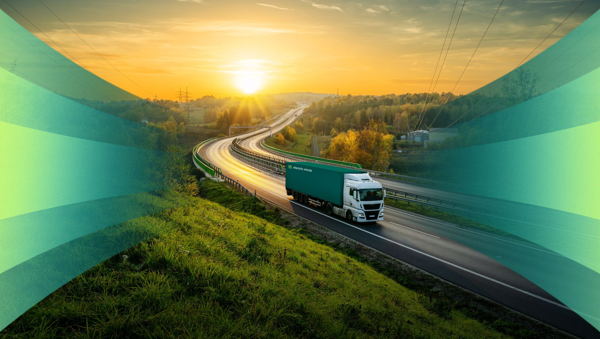 White semi-truck with teal trailer labeled 'electric minds' driving on a curving highway at sunset through green countryside.