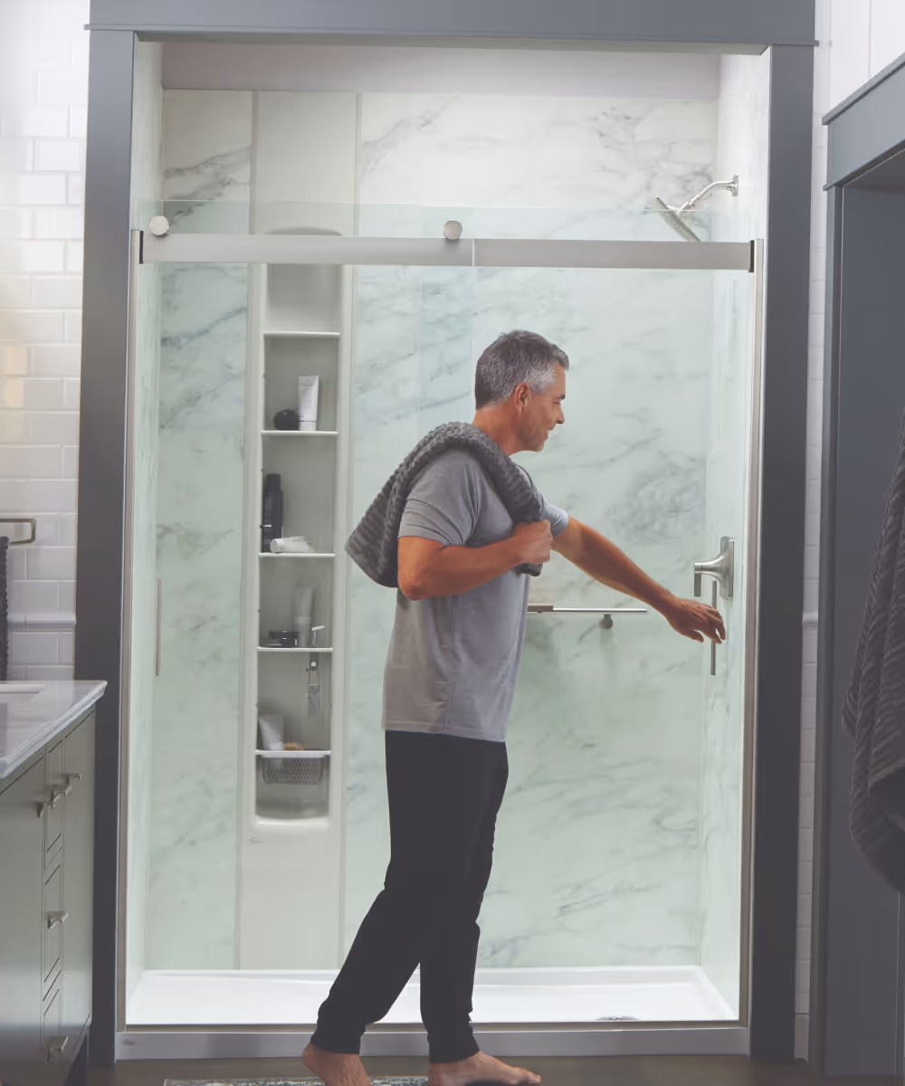 Modern Kohler shower remodel featuring sleek, glass panels and contemporary finishes.