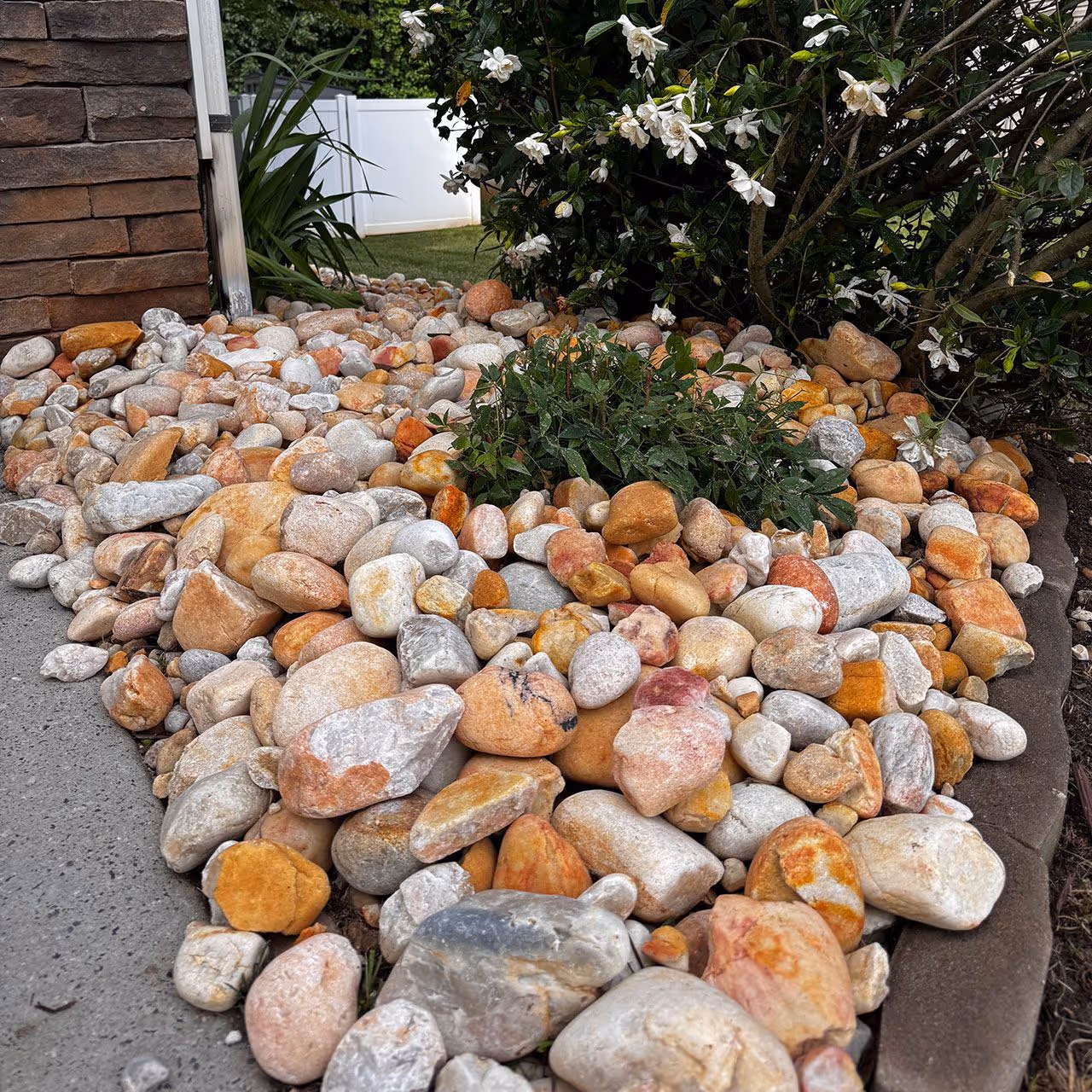 Assortment of decorative stones for a rock garden in front of a home in Marvin, NC
