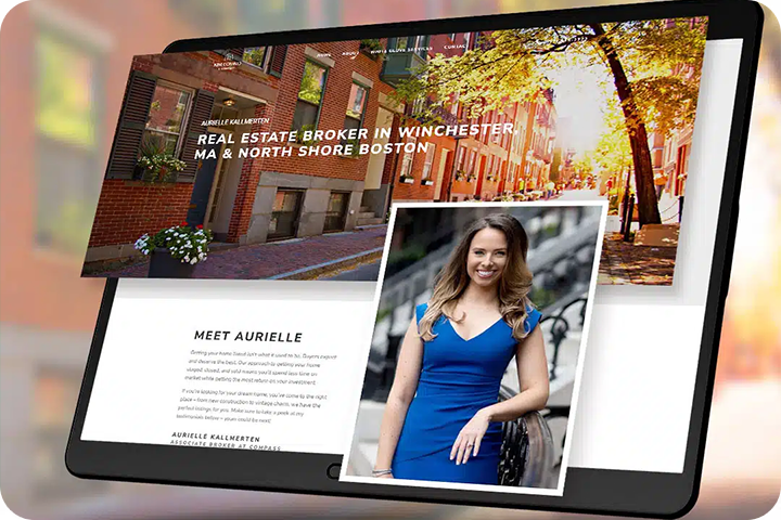 Person working on two computer screens.