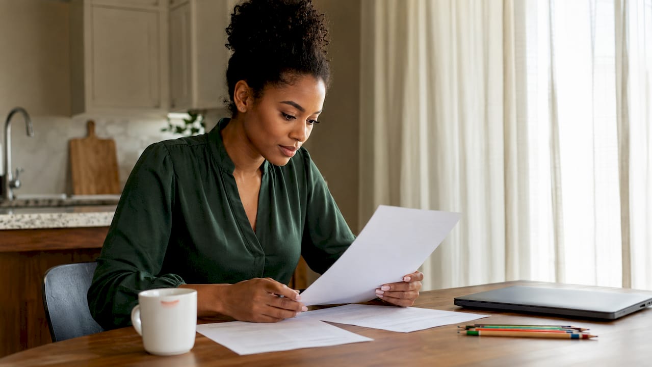 Woman reviewing zoning certificate papers