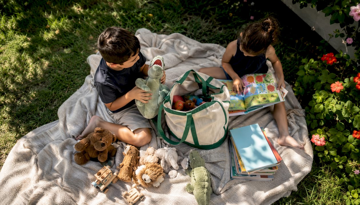 Children choosing toys to keep before moving