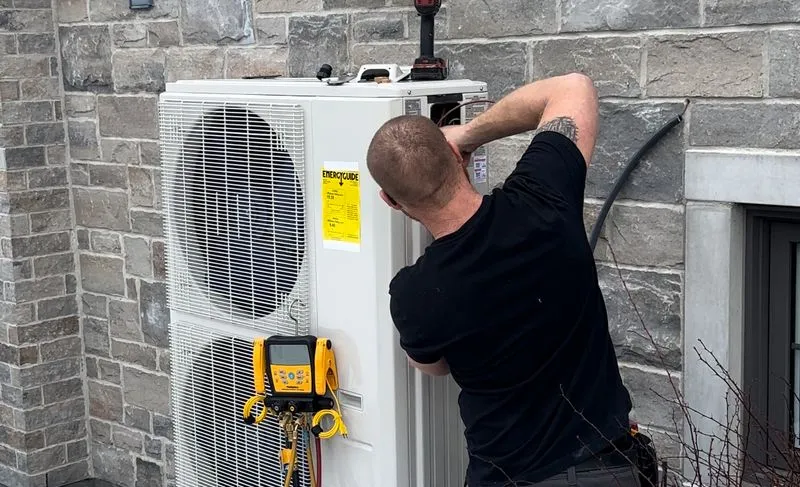 TRALO HVAC Technician working on installation