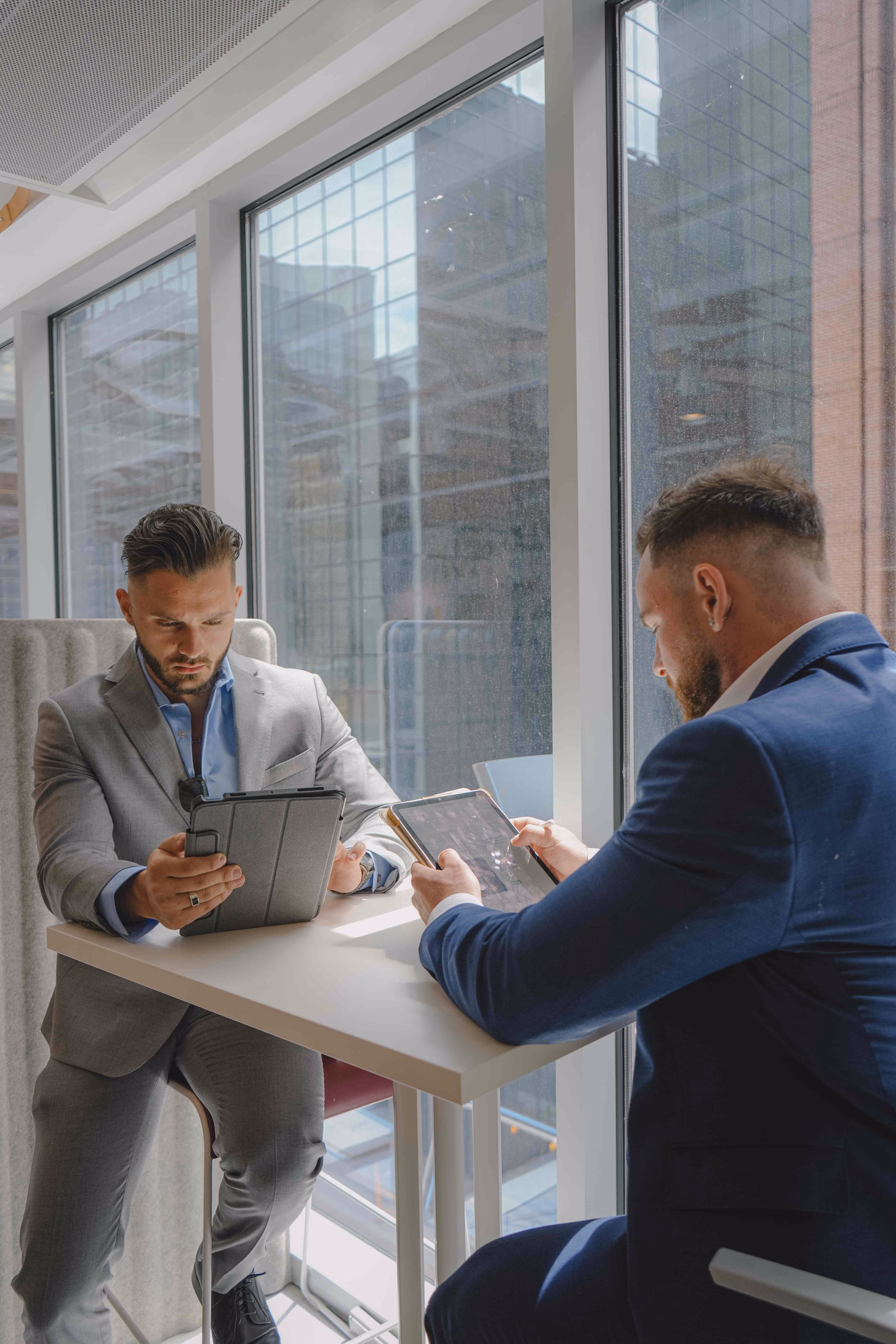 TRALO co-founder Travis Moriarty and Louis Lacombe-Denis looking over a service assessment