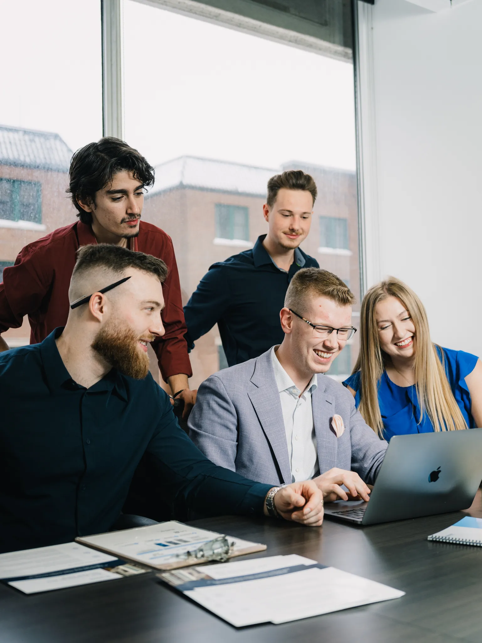 Members of the TRALO team working together in a group