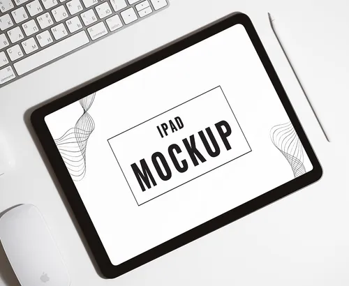 Top view of a tablet mockup with "PSD MOCKUP" text on the screen.