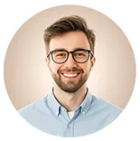Portrait of a smiling professional man wearing glasses and a light blue shirt, used on a personal portfolio website.