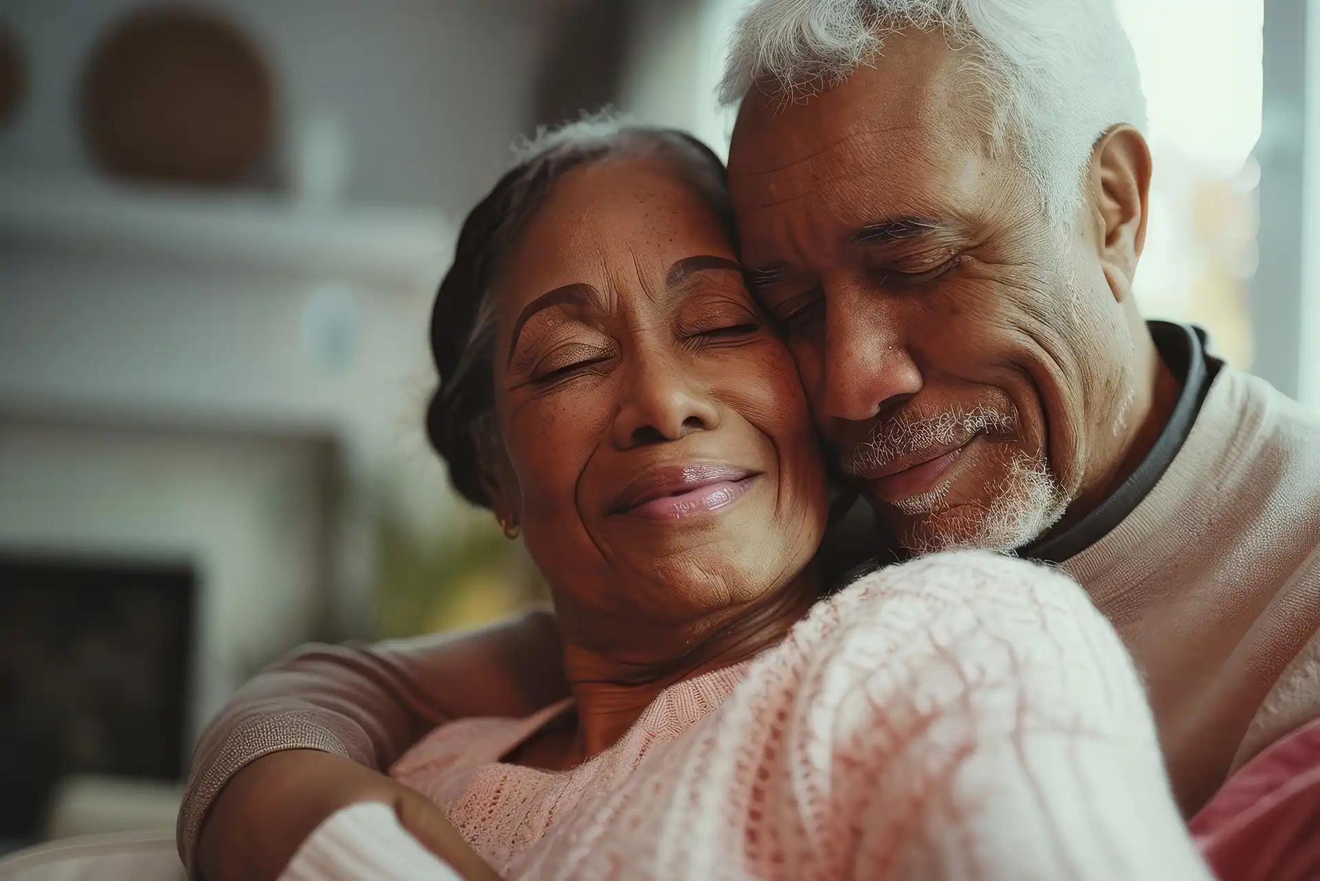 African american couple holding each other