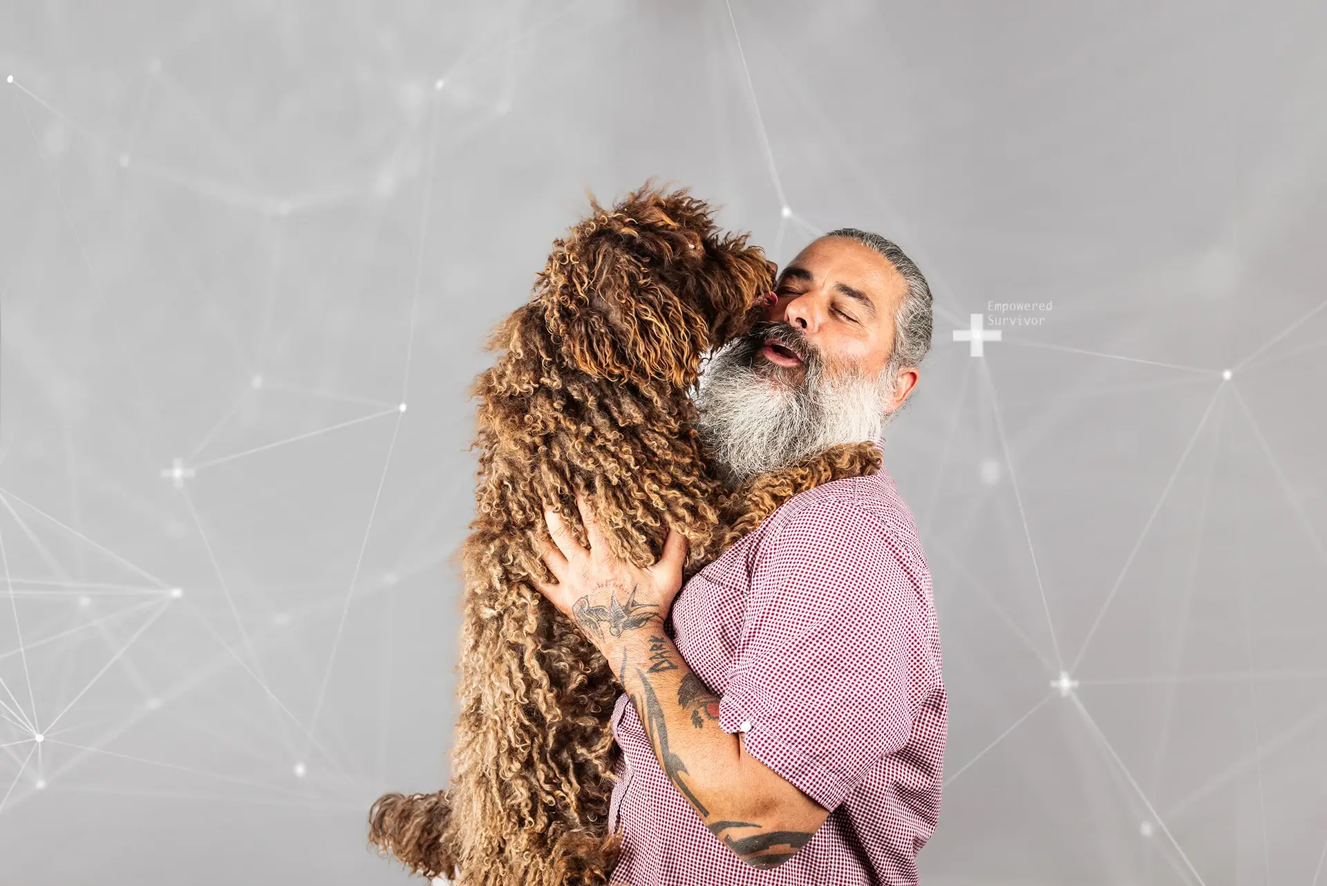 Older man holding a dog