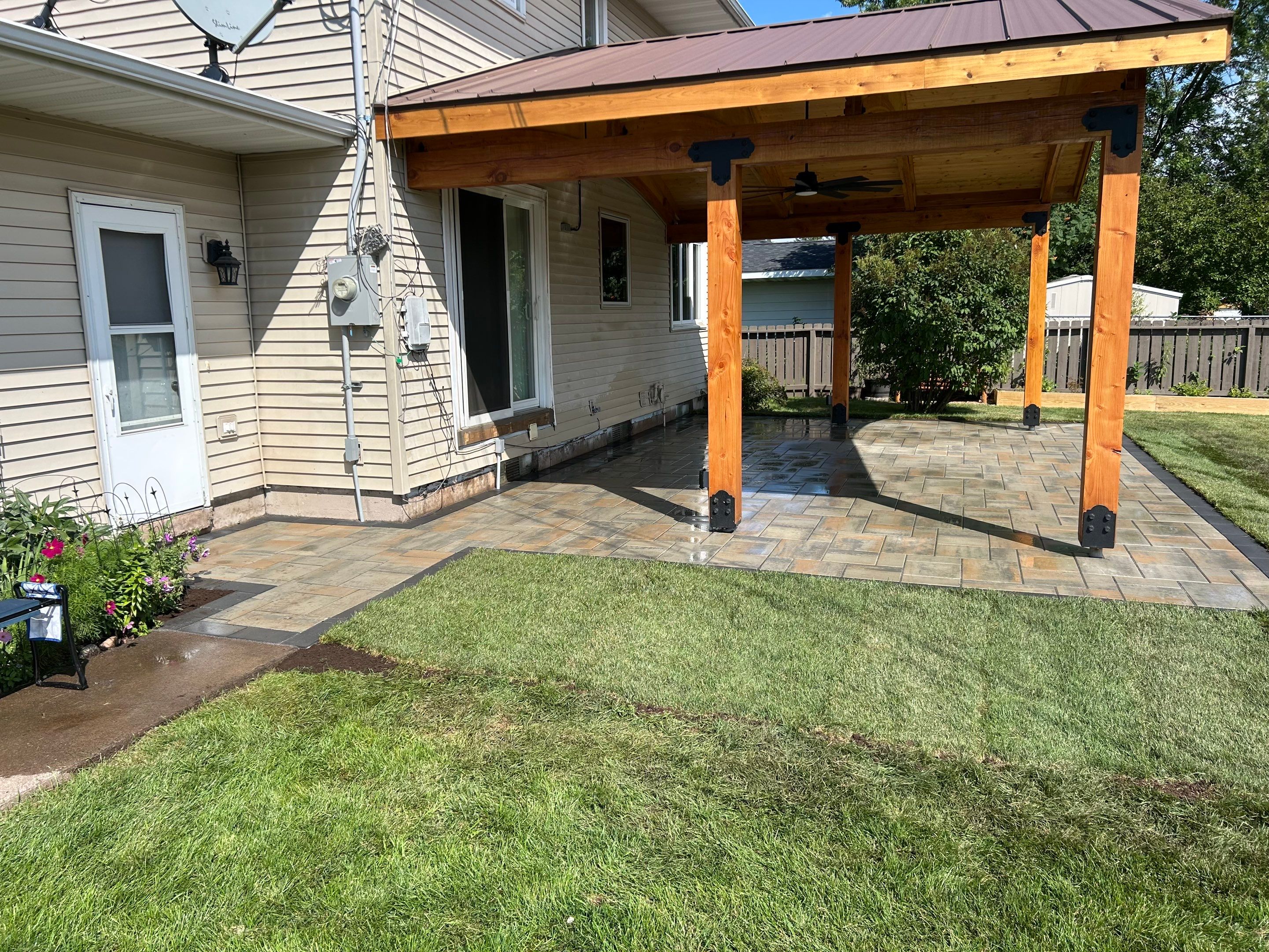 completed project with new sod laid to connect with the patio