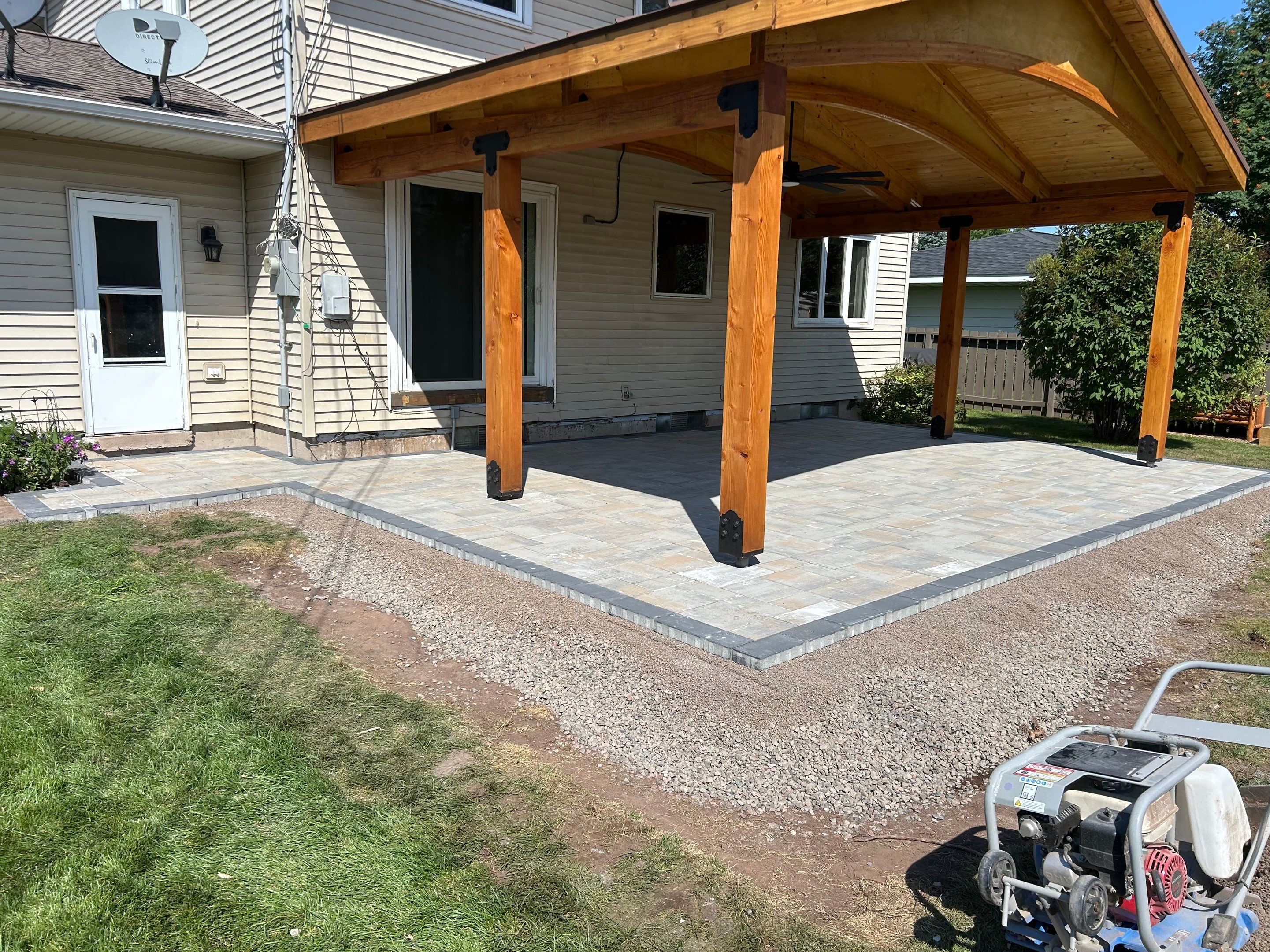 Owners had a paver patio installed, but did not complete the project by resodding the area around the patio