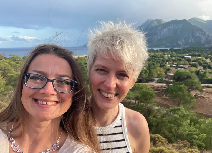 Two female friends with beautiful mountain views