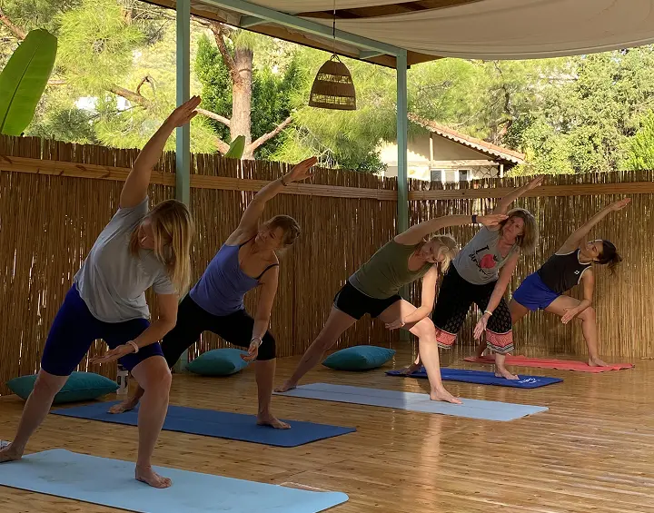 Women practicing extended side angle pose