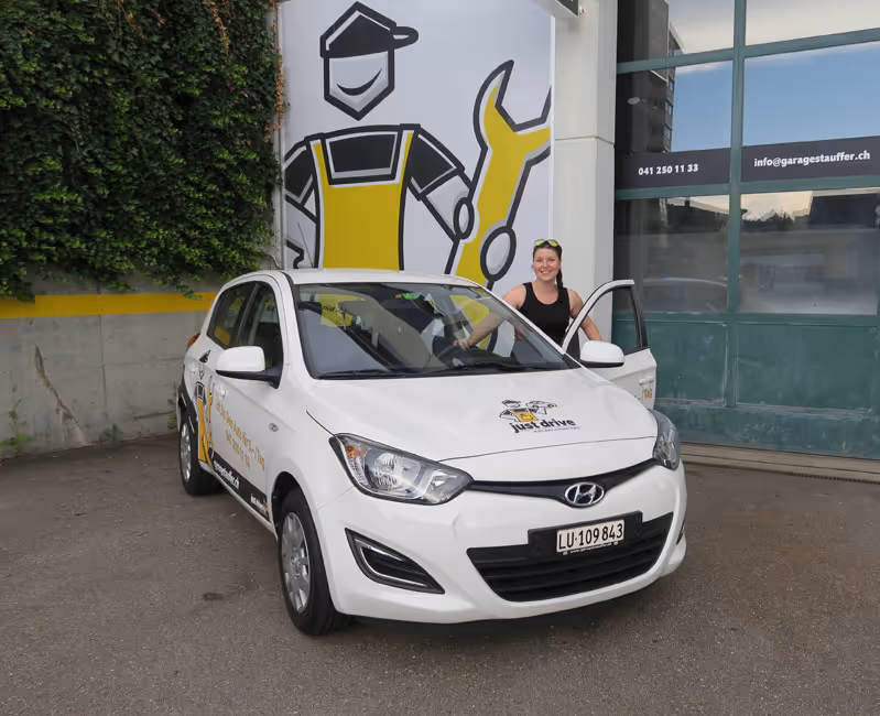 image of mechanics at work on a car