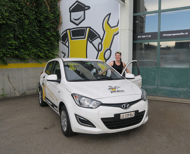 image of mechanics at work on a car