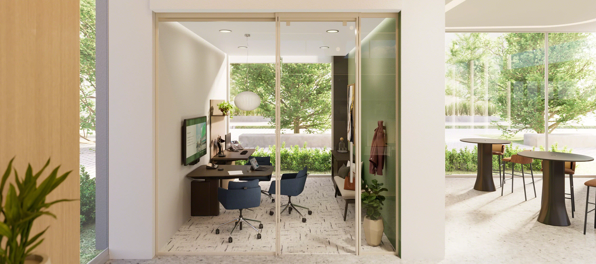 Modern small office with glass sliding doors, two blue swivel chairs, a wall-mounted TV, desks with computers, and a seating area with a coat hanging on the wall.