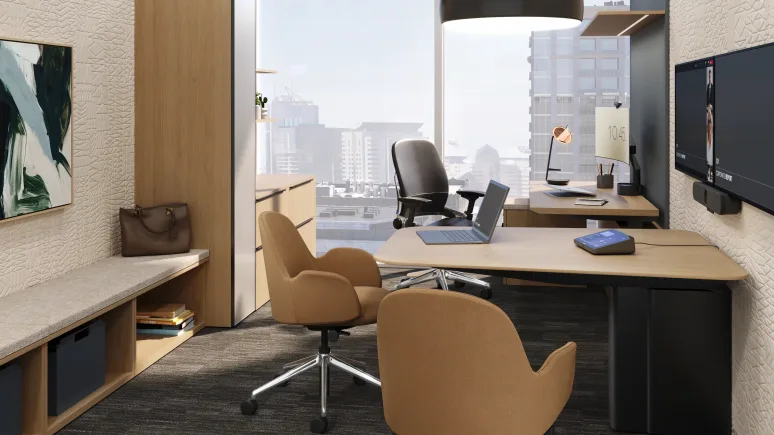 Modern office with two brown swivel chairs, a black office chair, a laptop on the desk, and large windows overlooking a cityscape.