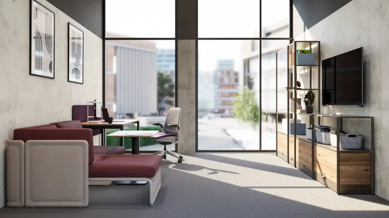 Modern office space with large floor-to-ceiling windows, a maroon sectional sofa, a desk with an office chair, and shelving with decorative items and a wall-mounted TV.