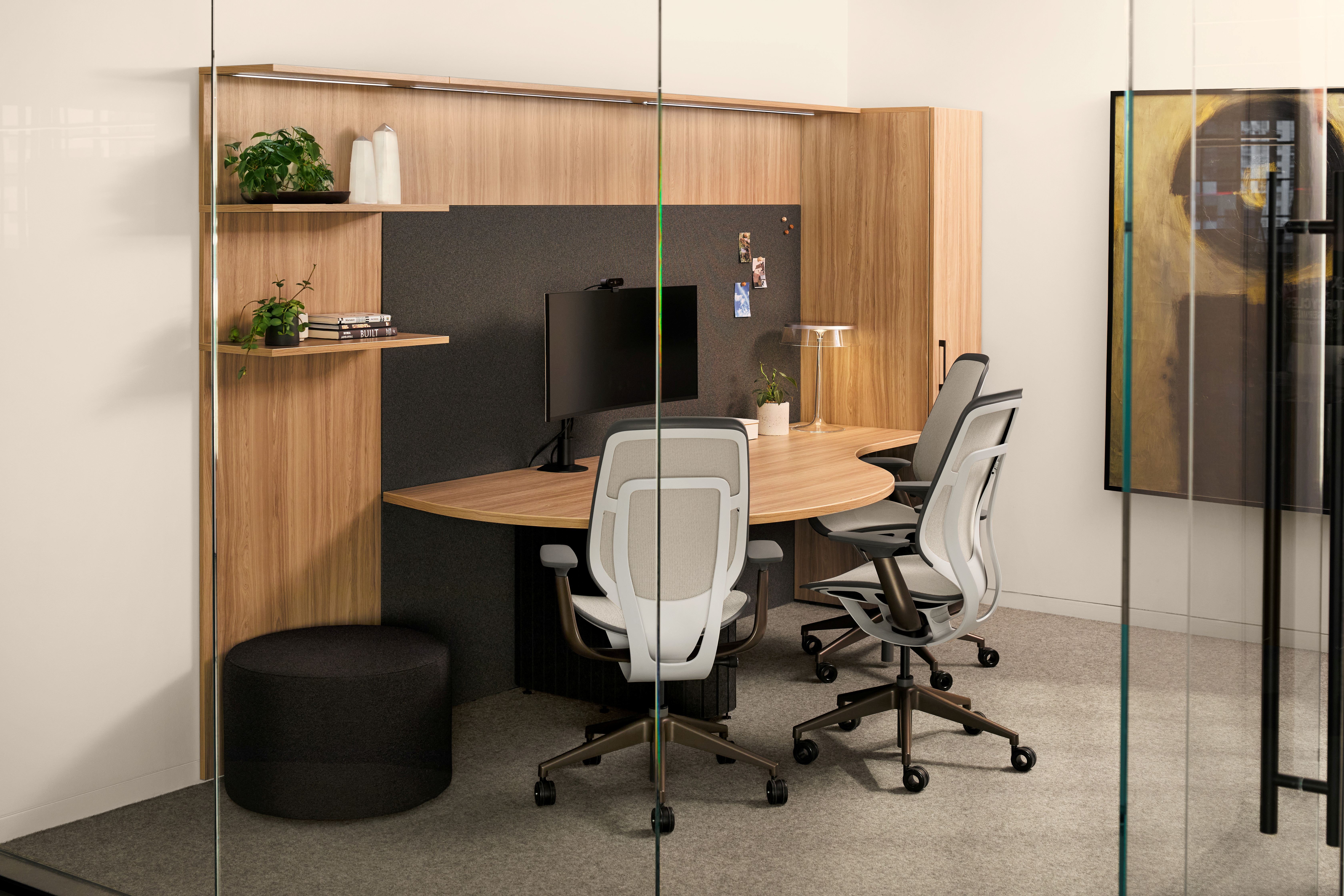 Modern working room with wooden chairs, whiteboard on wooden wall, large window, and green plant in a beige pot.