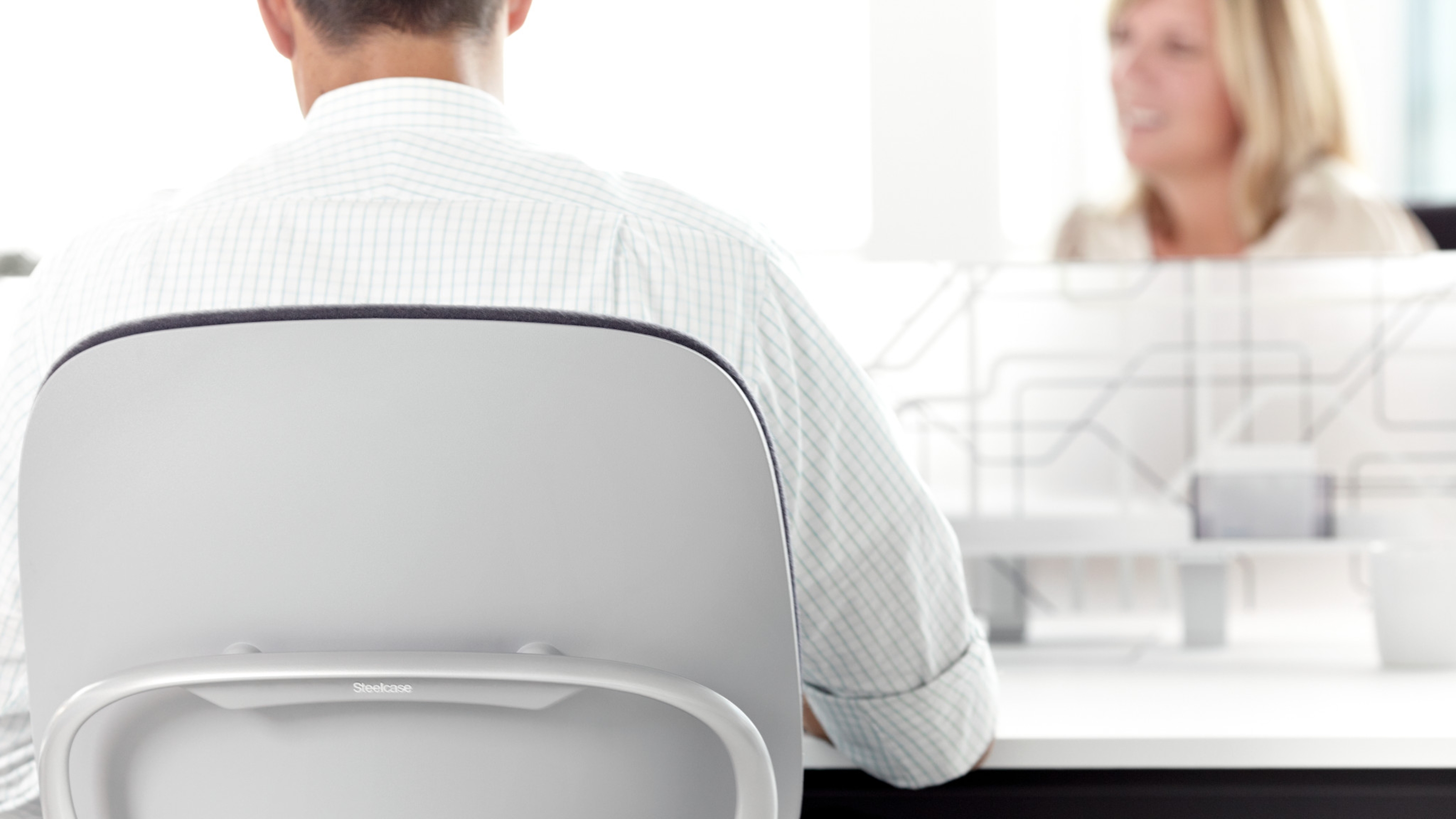 Steelcase Leap ergonomic office chair in a retail banking workstation