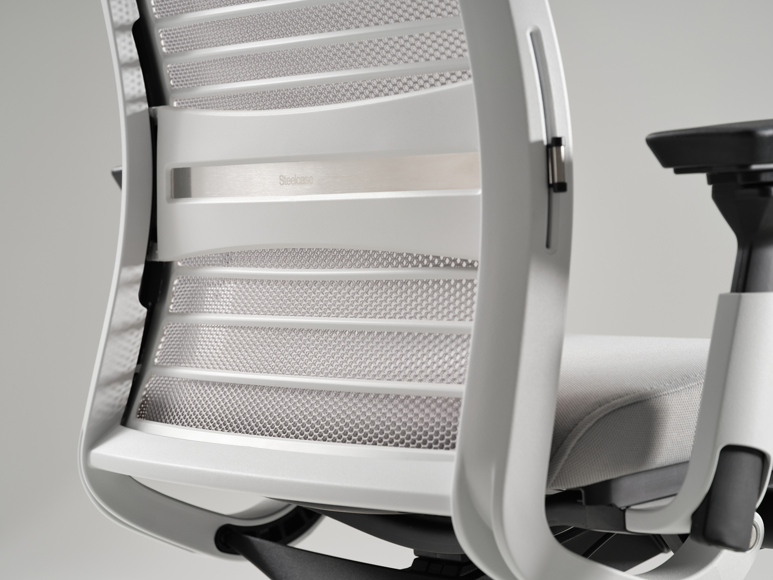 Steelcase Think ergonomic task chair at a modern desk setup