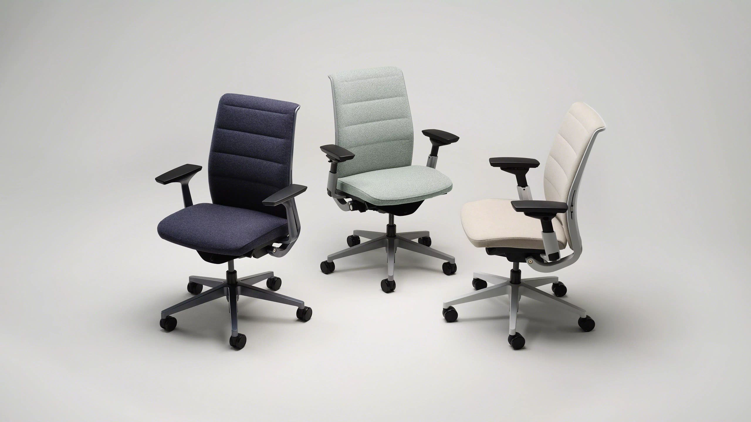 Steelcase Think ergonomic task chair at a modern desk setup