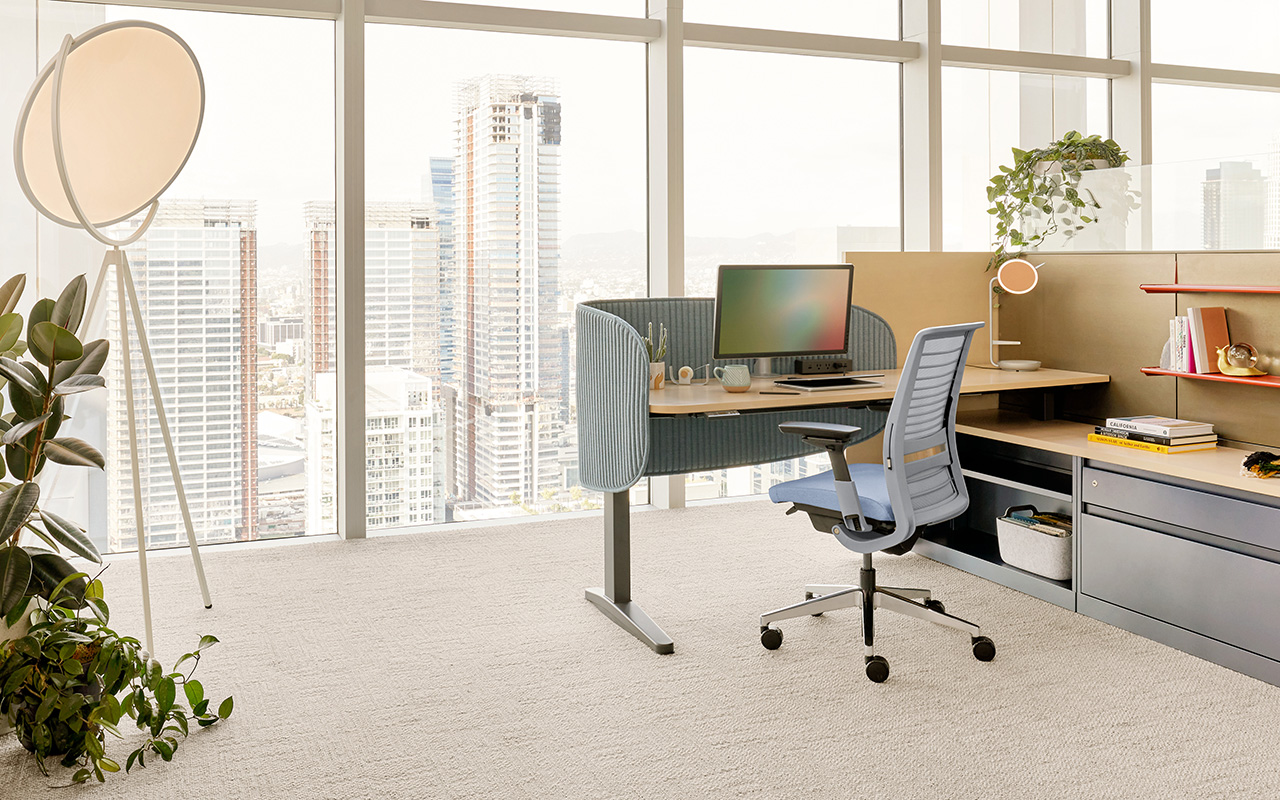 Steelcase Think ergonomic task chair at a modern desk setup