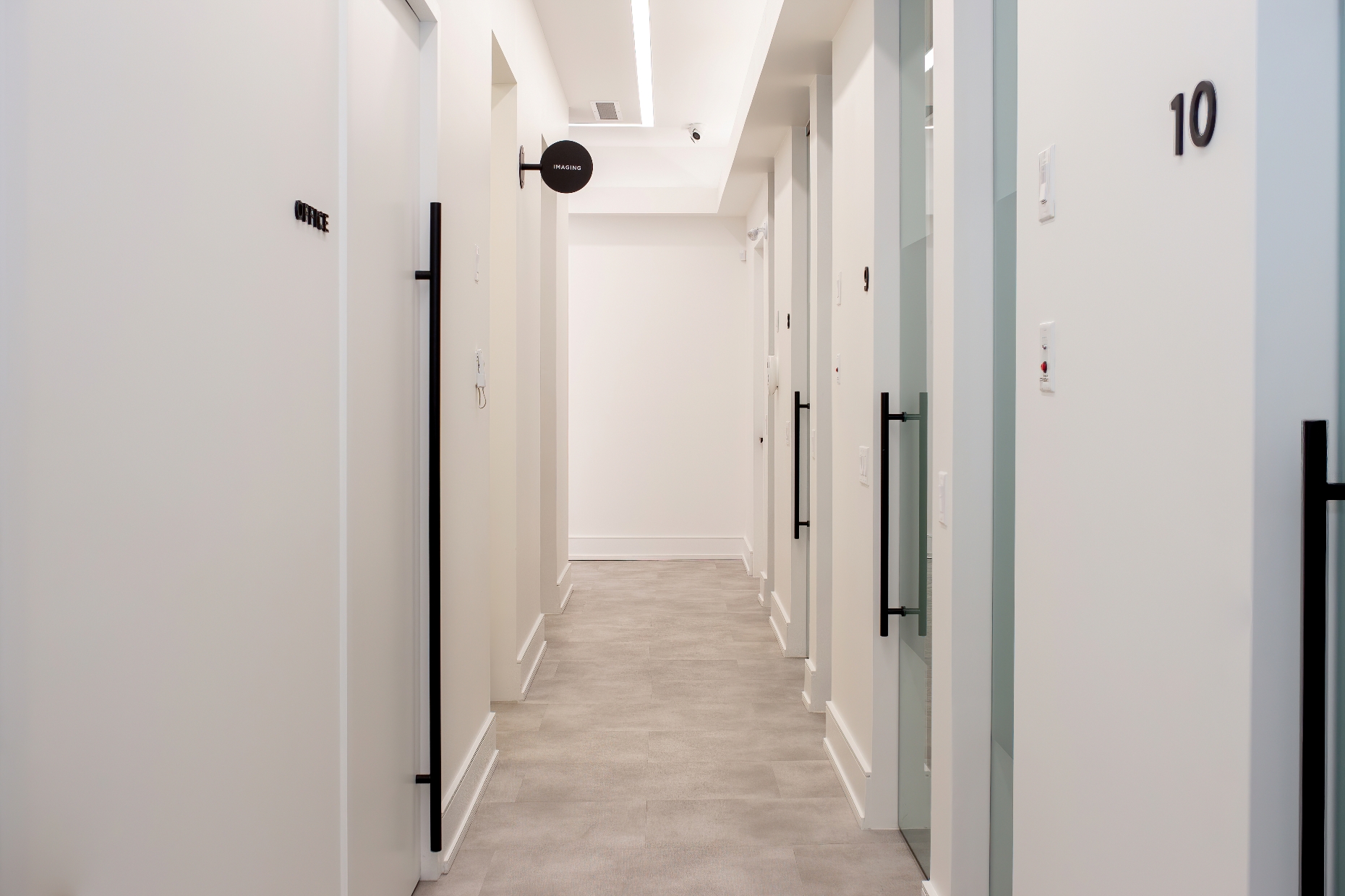 Pivot door office partition system creating private workspace areas