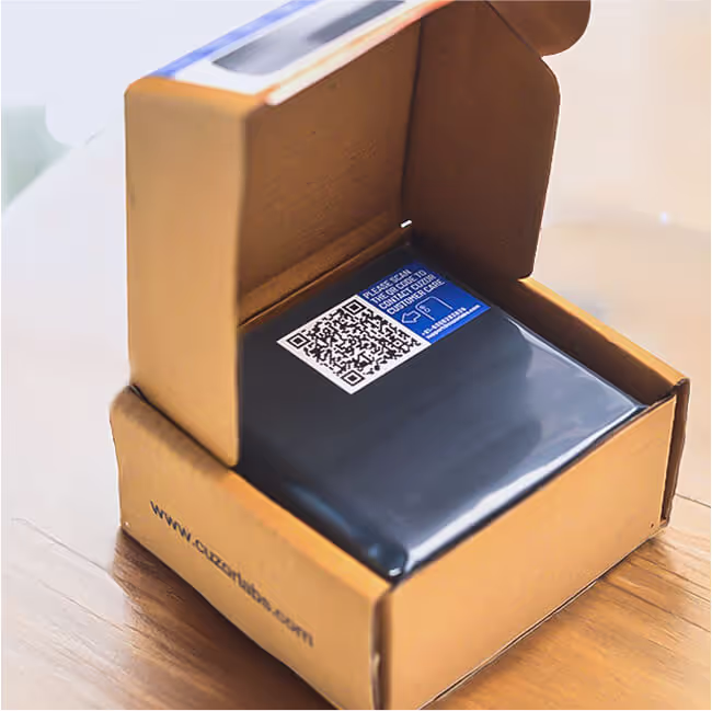 A Cuzor Router UPS in its cardboard box, packed and ready to go