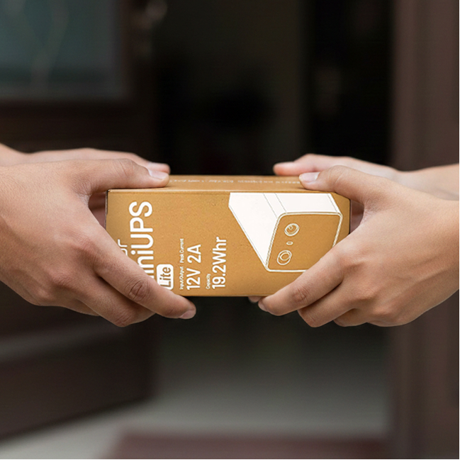 A Cuzor Router UPS in its cardboard box, packed and ready to go