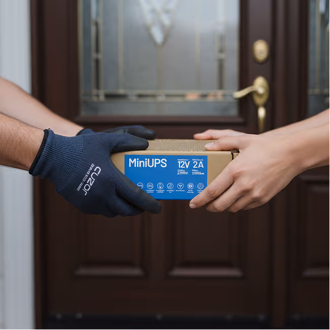 A Cuzor Router UPS in its cardboard box, packed and ready to go