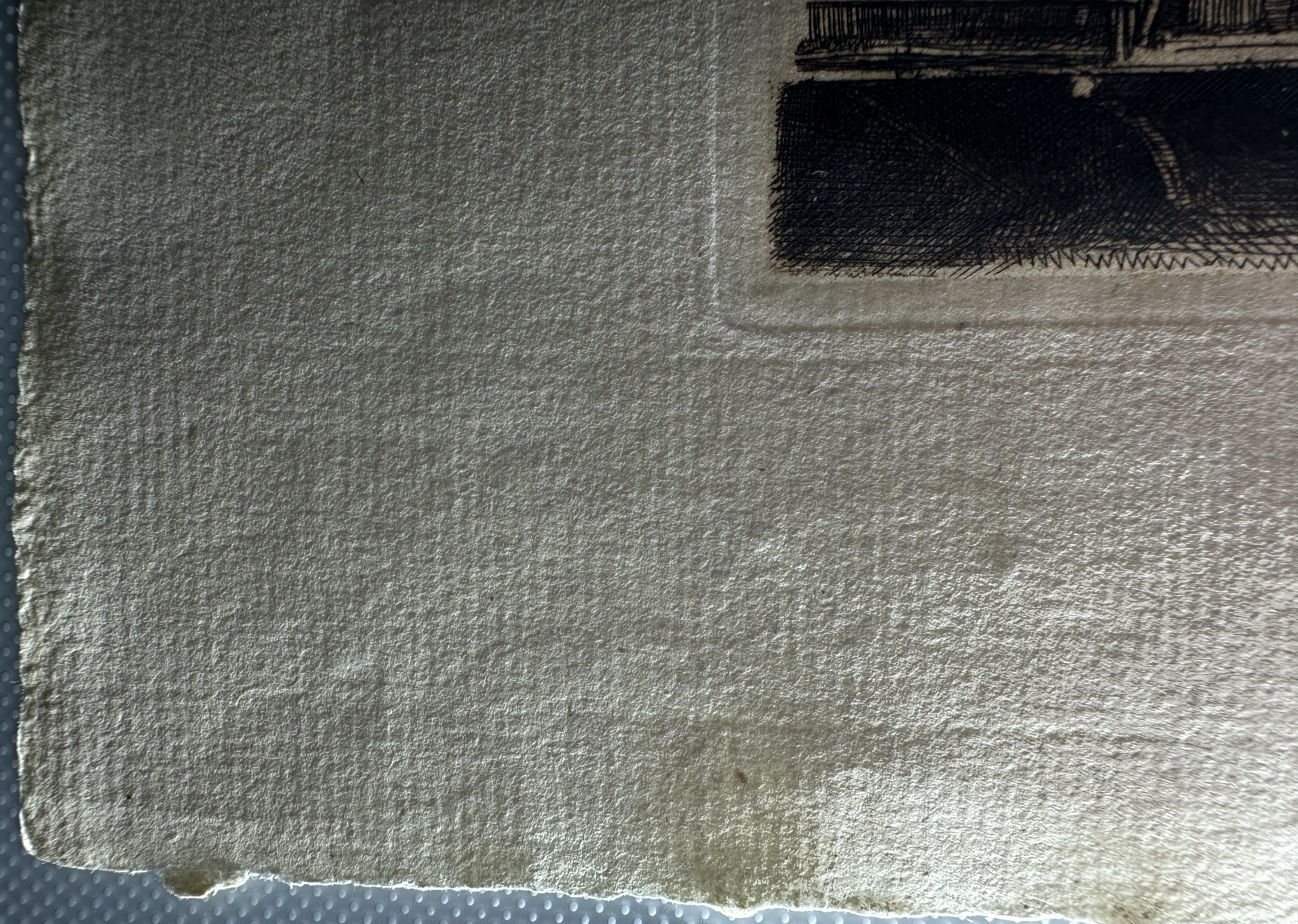 Platemark, lower left