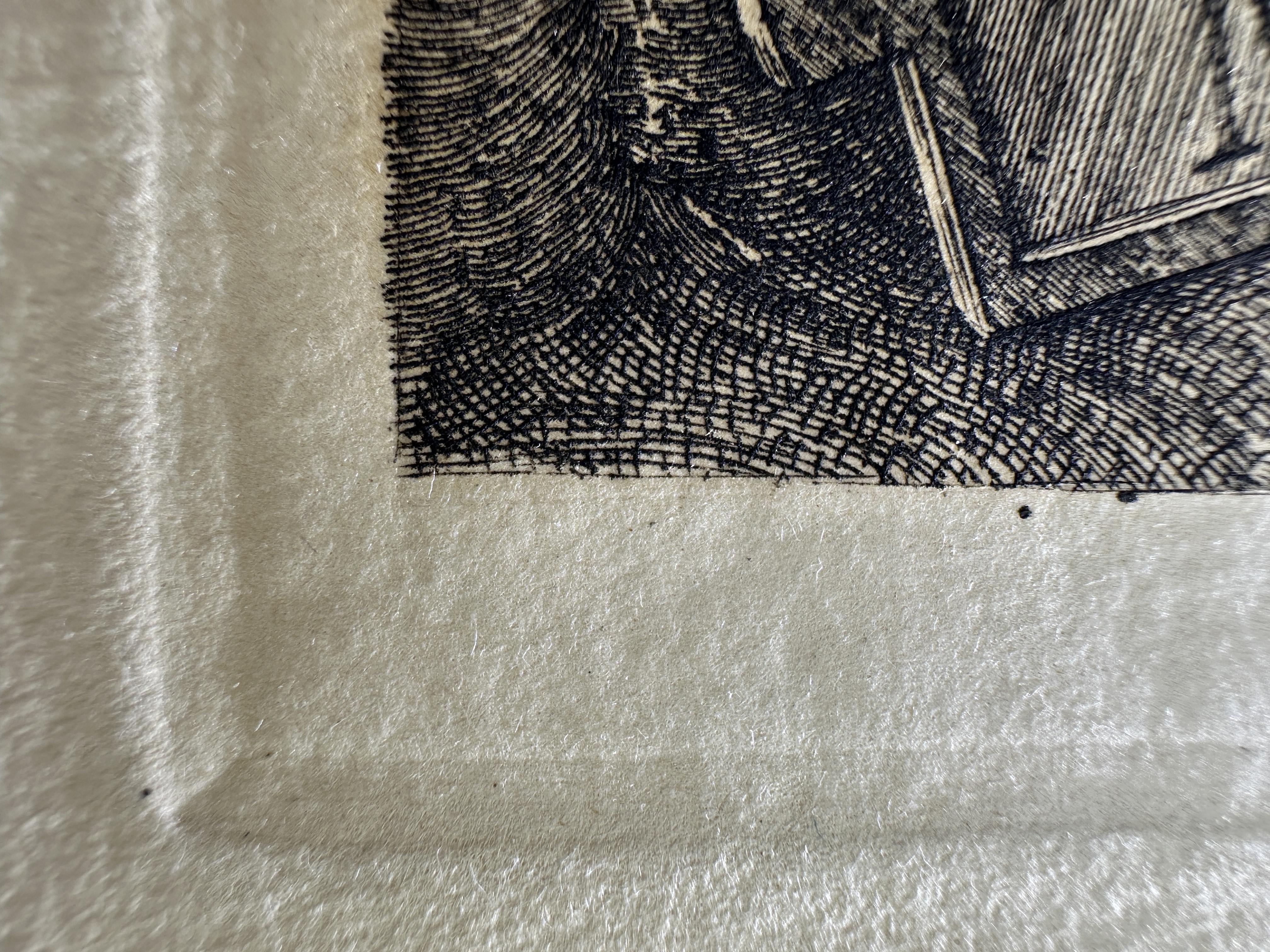 Platemark, lower left