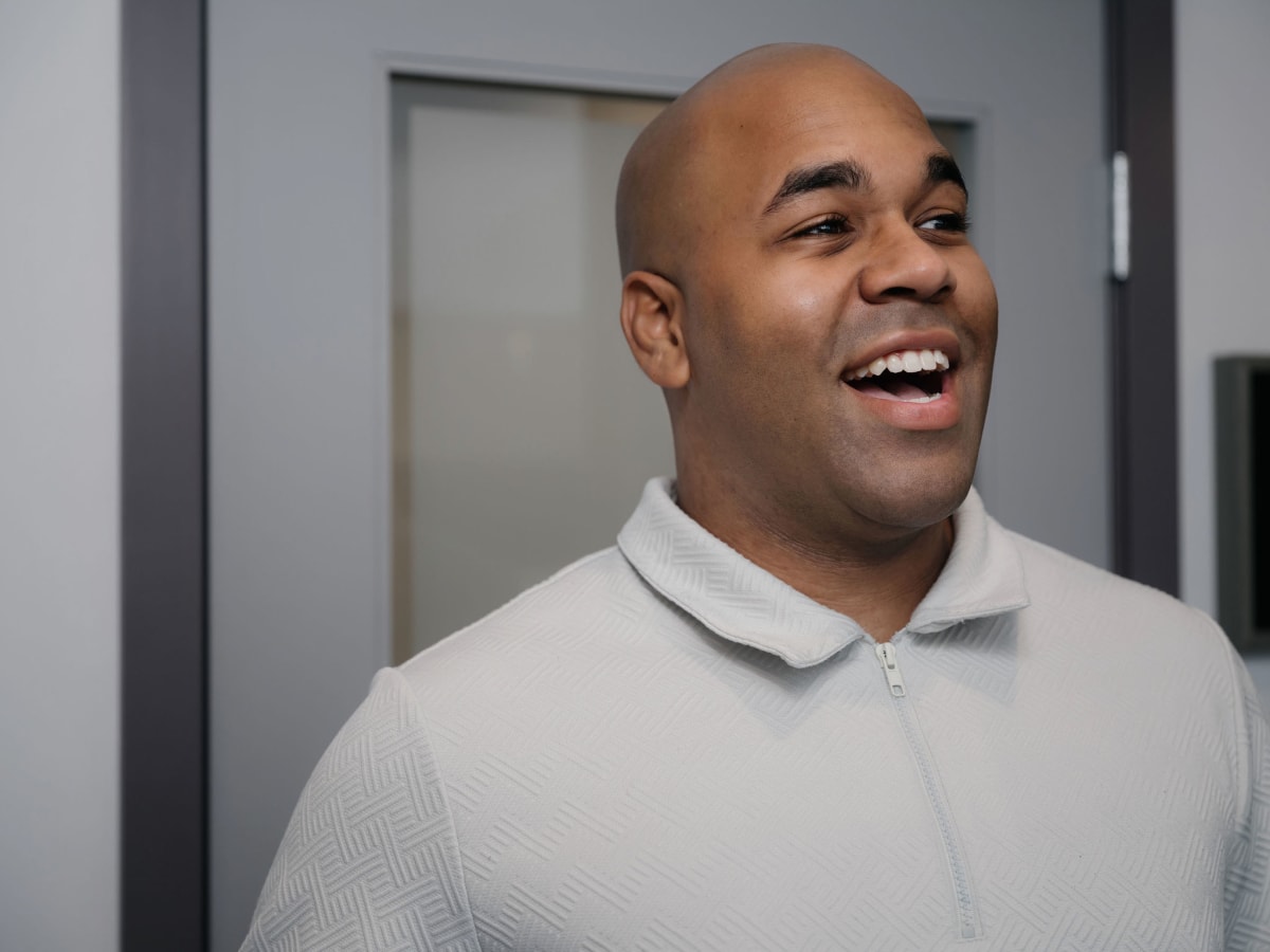 Male dentist smiling at Genuine Smiles dental practice in Everett