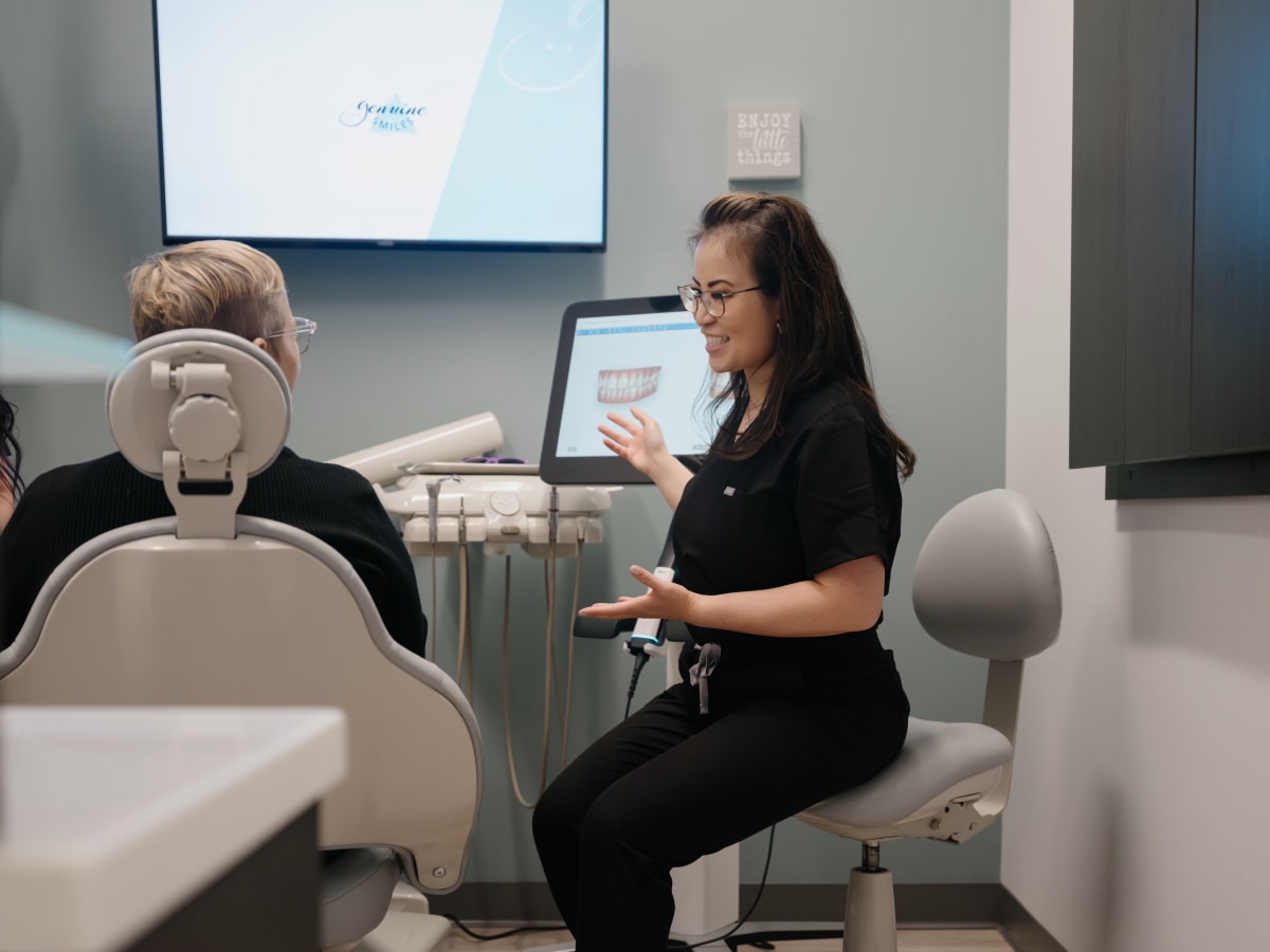 Dentist consulting with patient in Everett dental office treatment room.