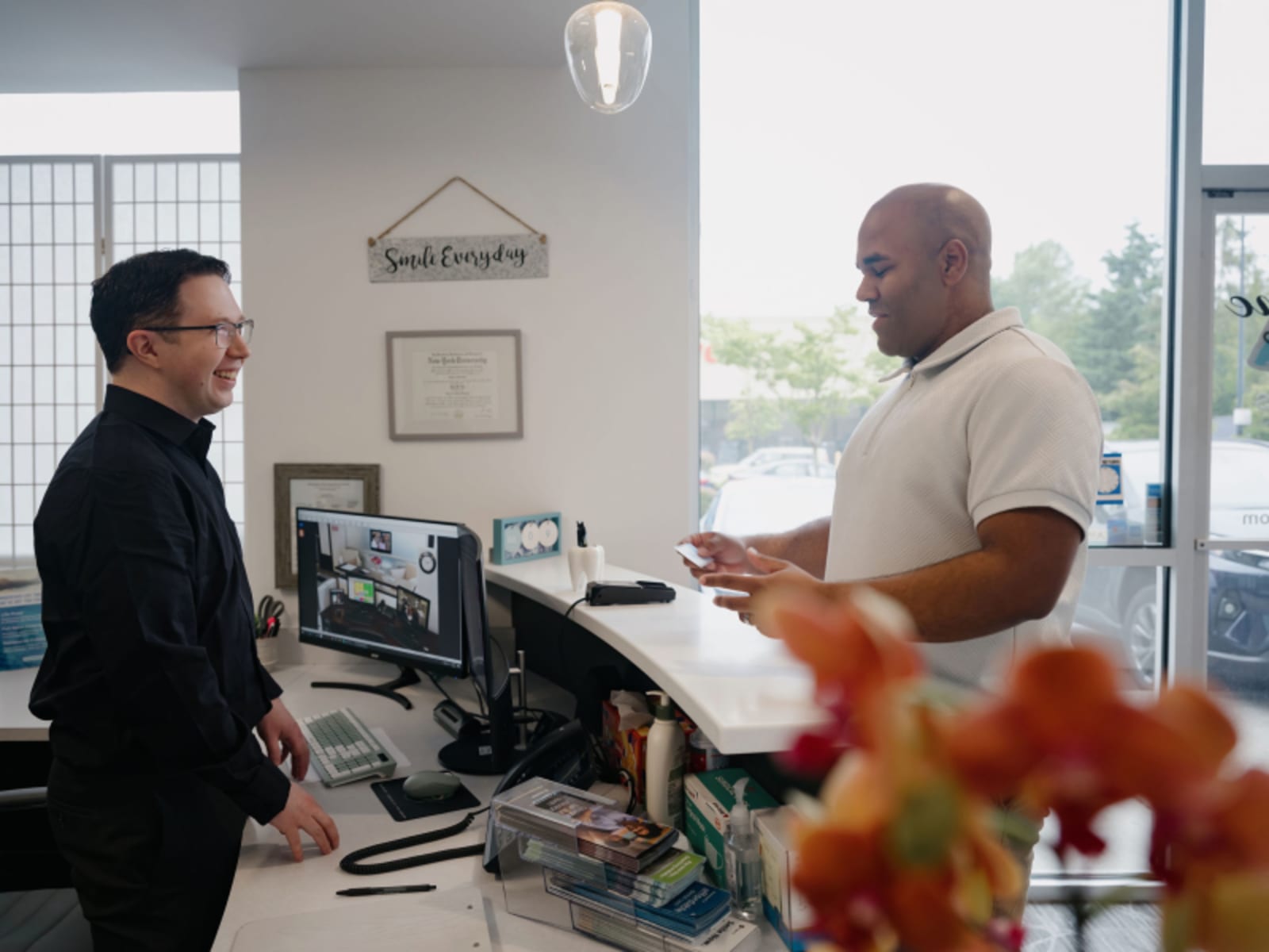 Two professionals discussing treatment options at Genuine Smiles dental practice in Everett.