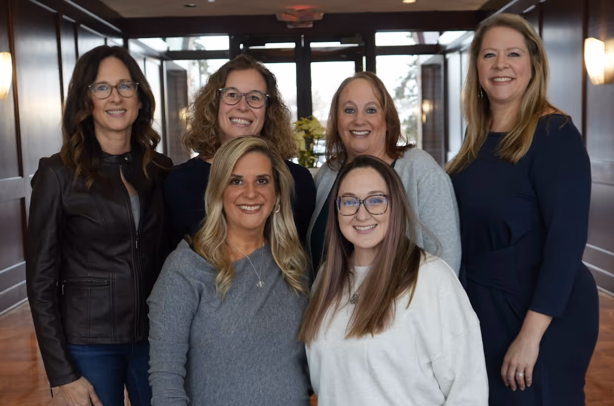 Therapists standing together in their office