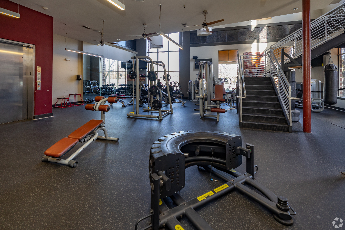fitness center with free weights and training machinery 