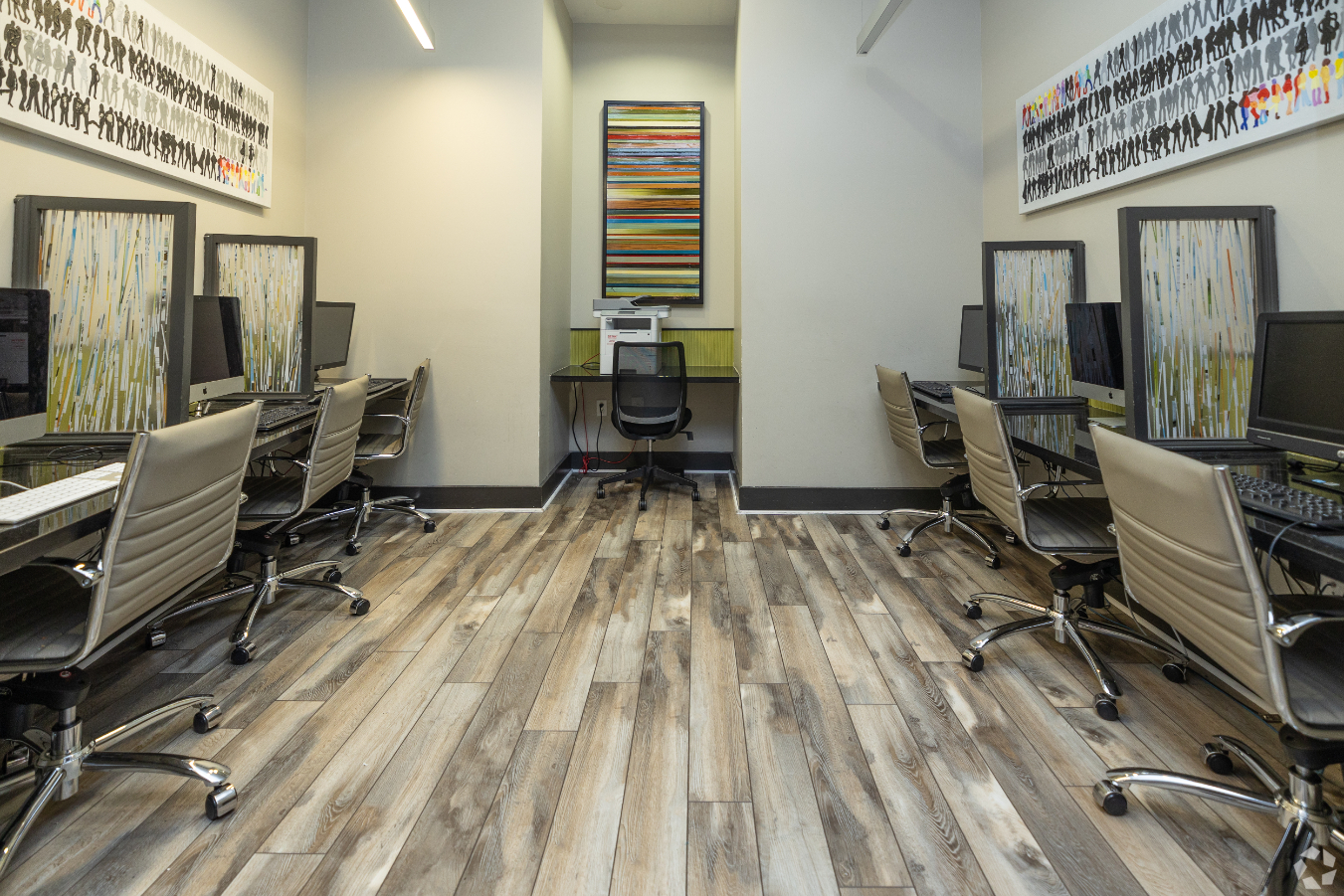 Business center with desks, chairs, and computers