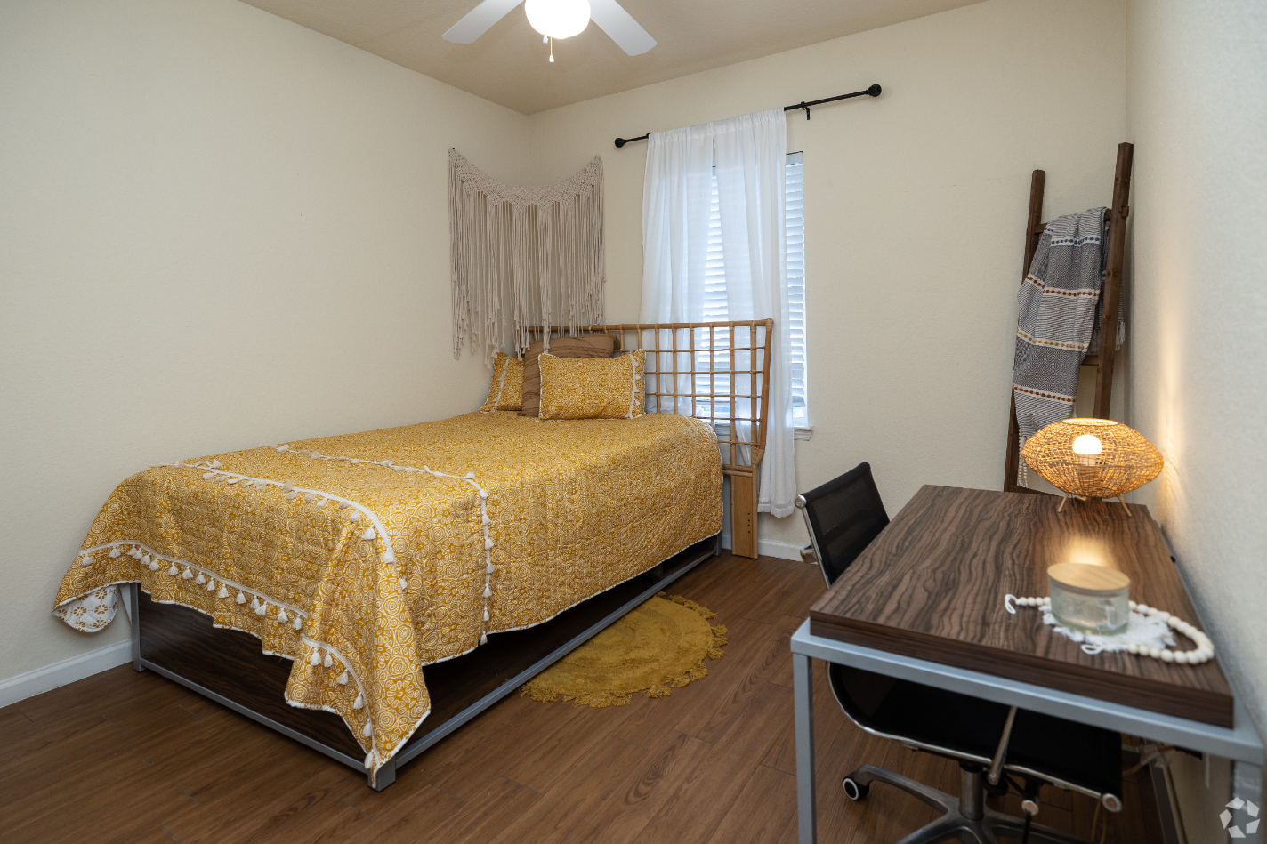 bedroom with bed and desk with chair