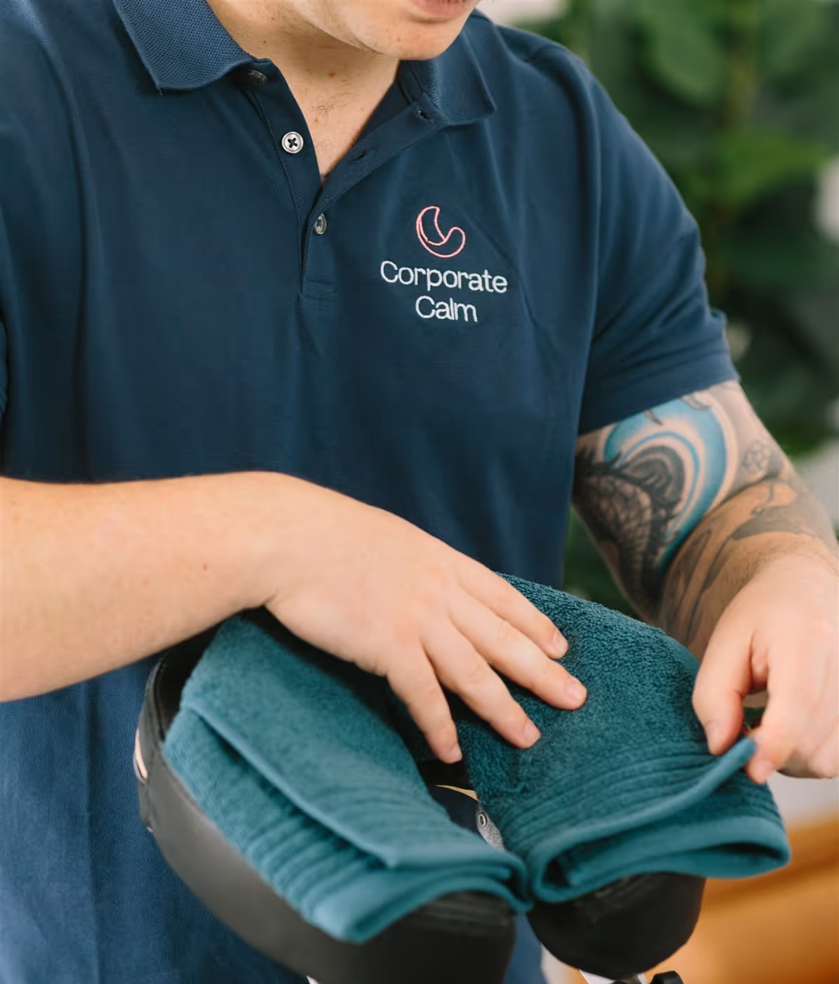 Corporate Calm therapist setting up portable massage chair for a corporate event