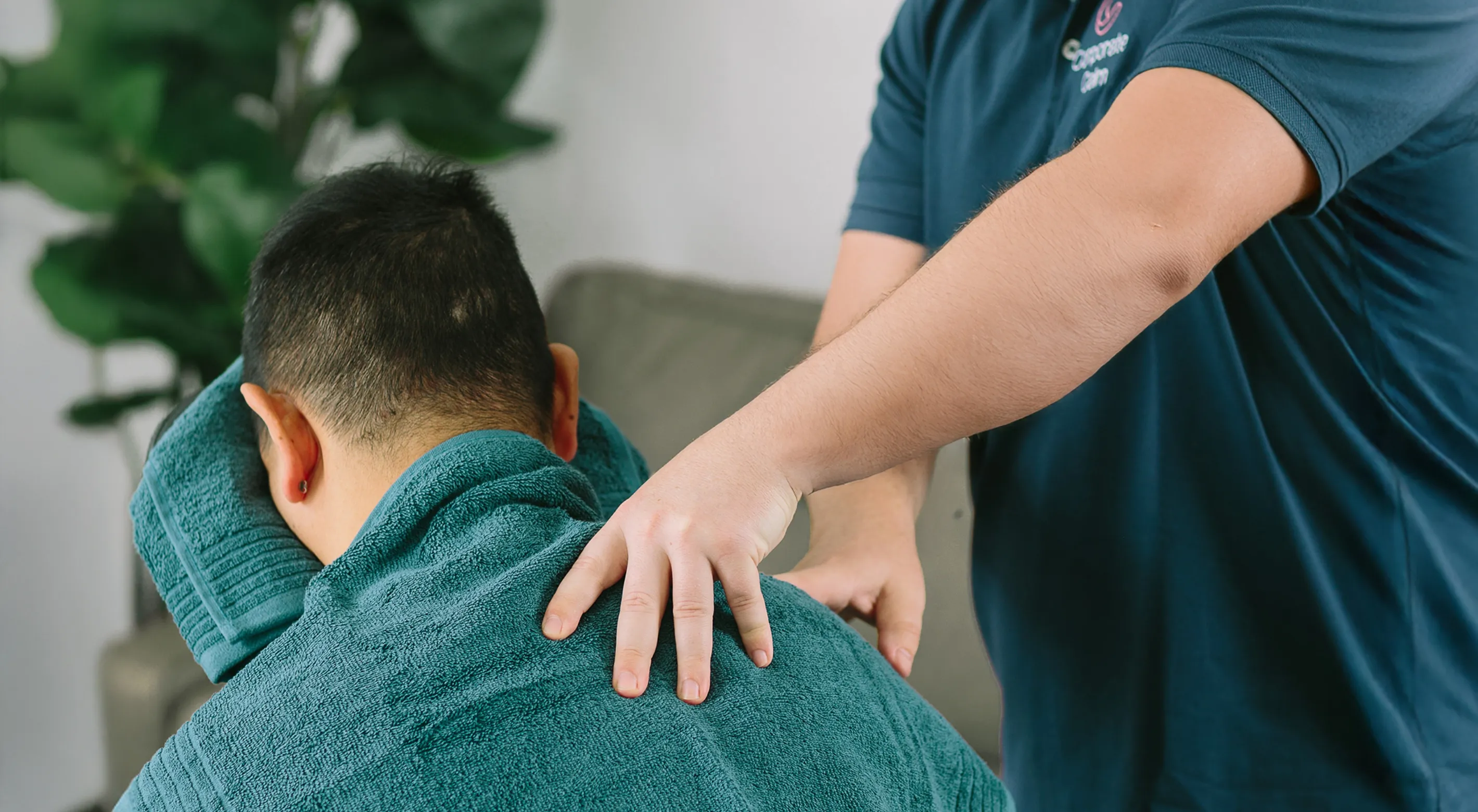 Corporate Calm therapist delivering workplace massage to a software developer