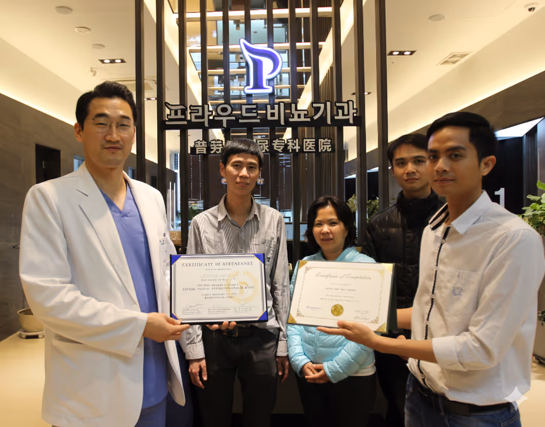 Five people standing in a well-lit modern office holding certificates