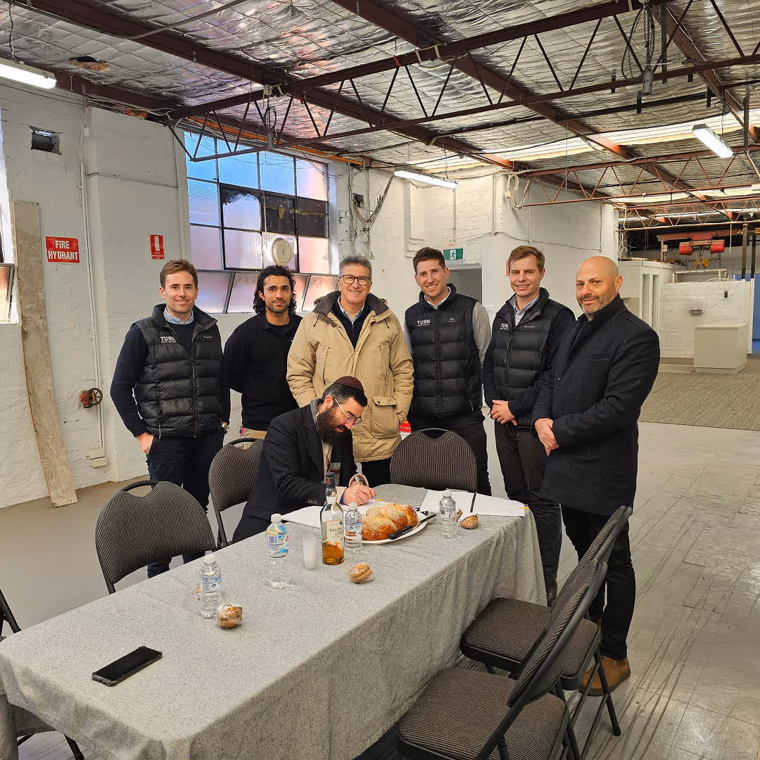 C Care staff standing round table